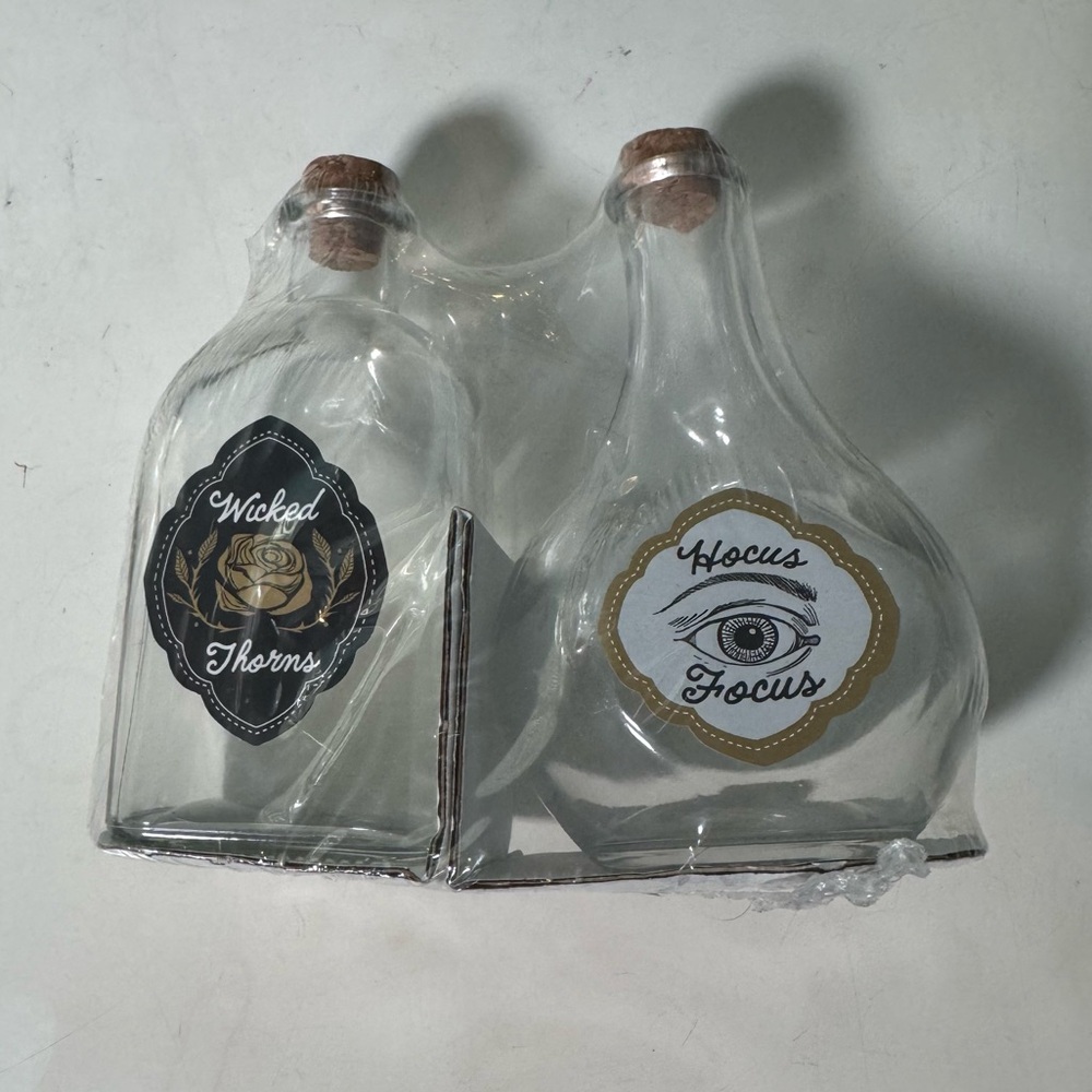 Set of Two Decorative Glass Bottles with Labels